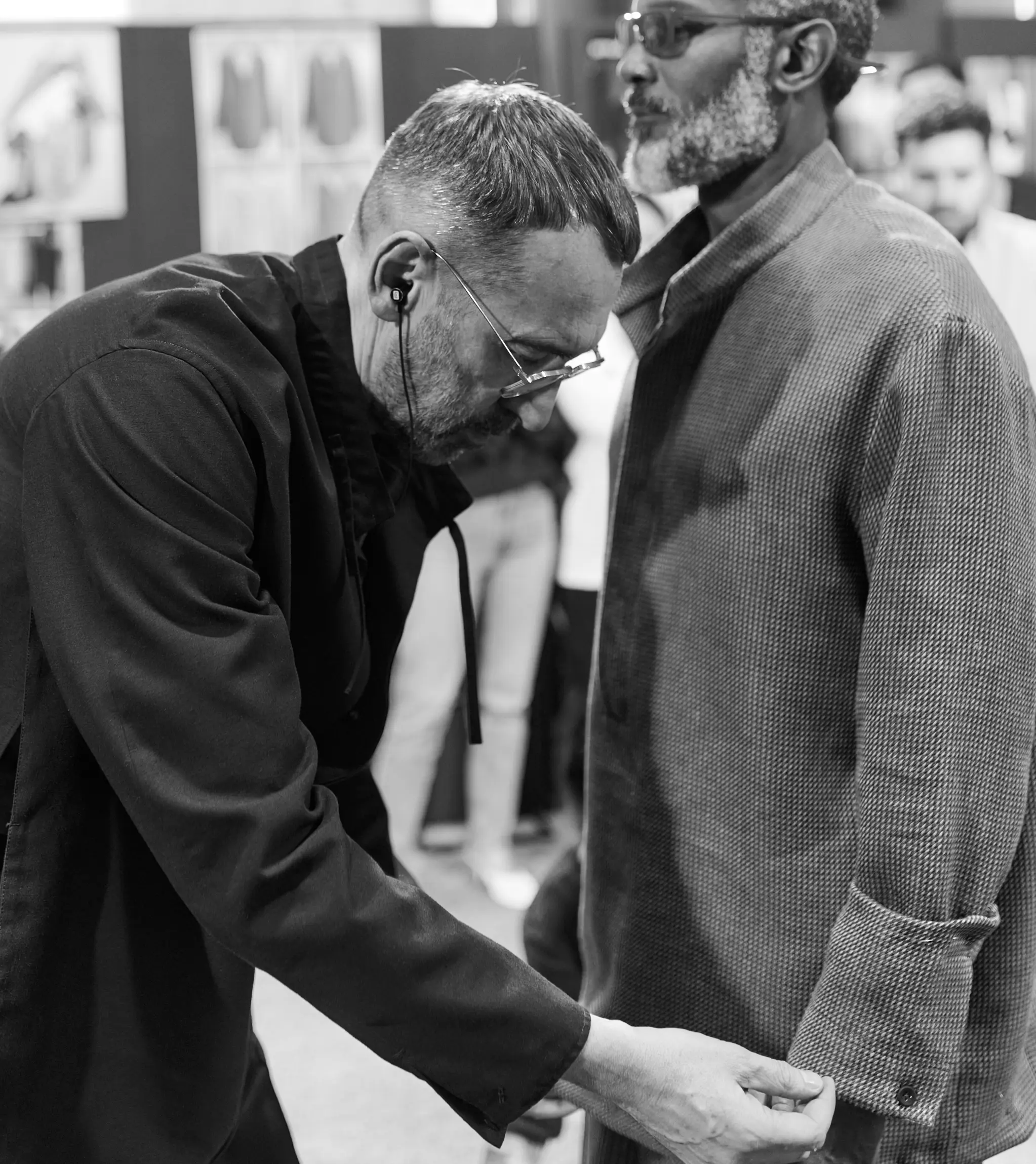 Alessandro Sartori refines look details in backstage the ZEGNA Summer 2026 Fashion Show.