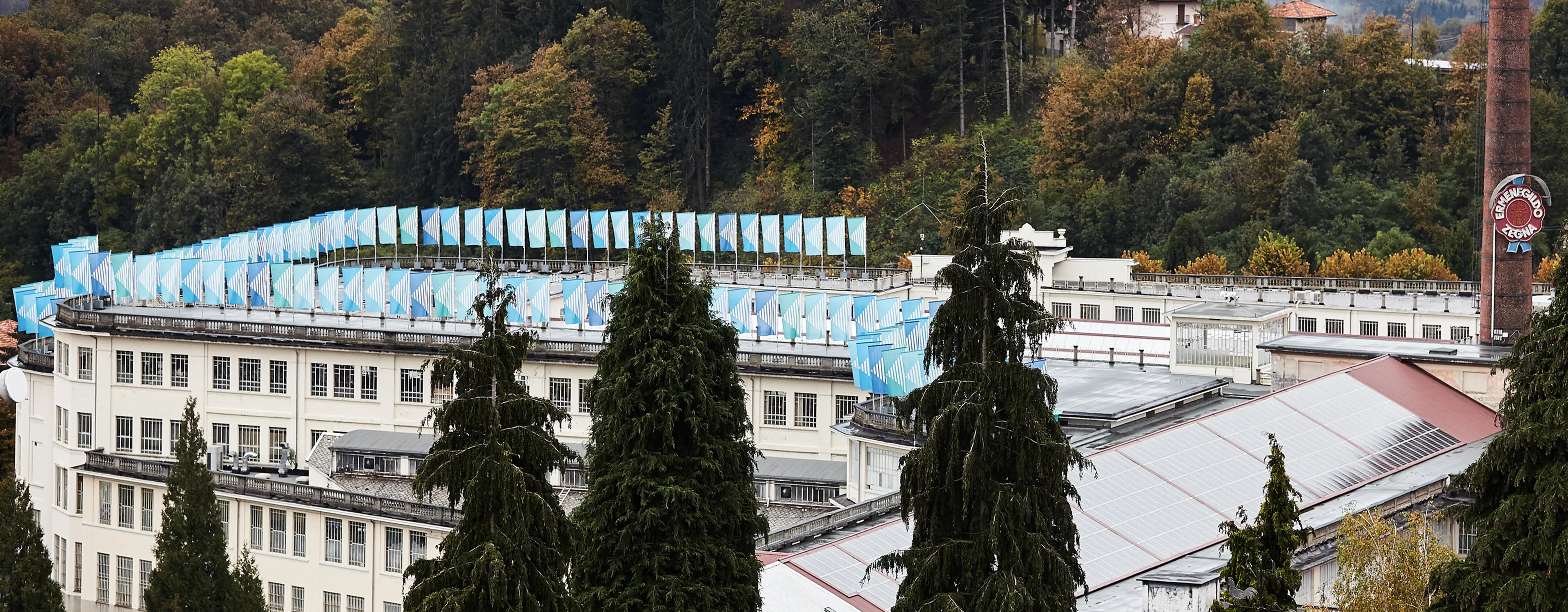 Outdoor installation of colorful wind vanes by Daniel Buren at Lanificio Zegna.