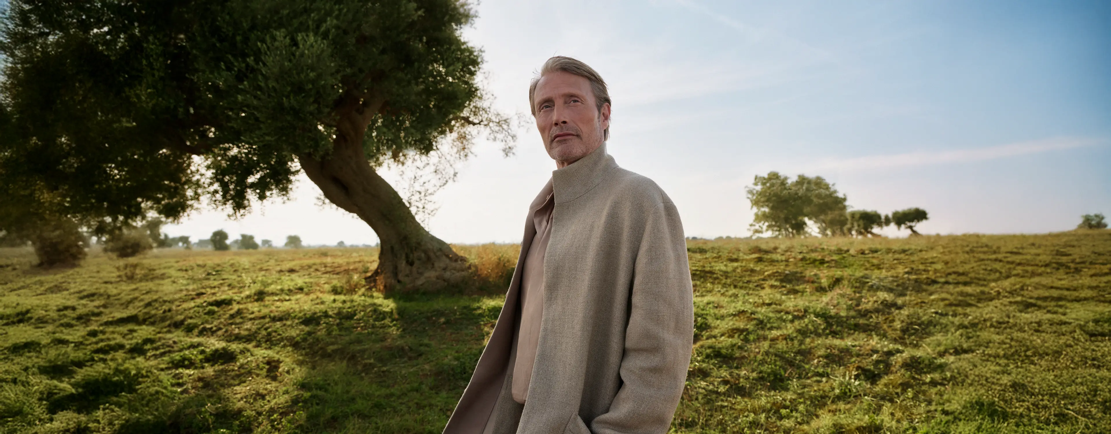 Mads Mikkelsen wearing a tailored outfit with a coat from the ZEGNA Spring/Summer 2025 collection.
