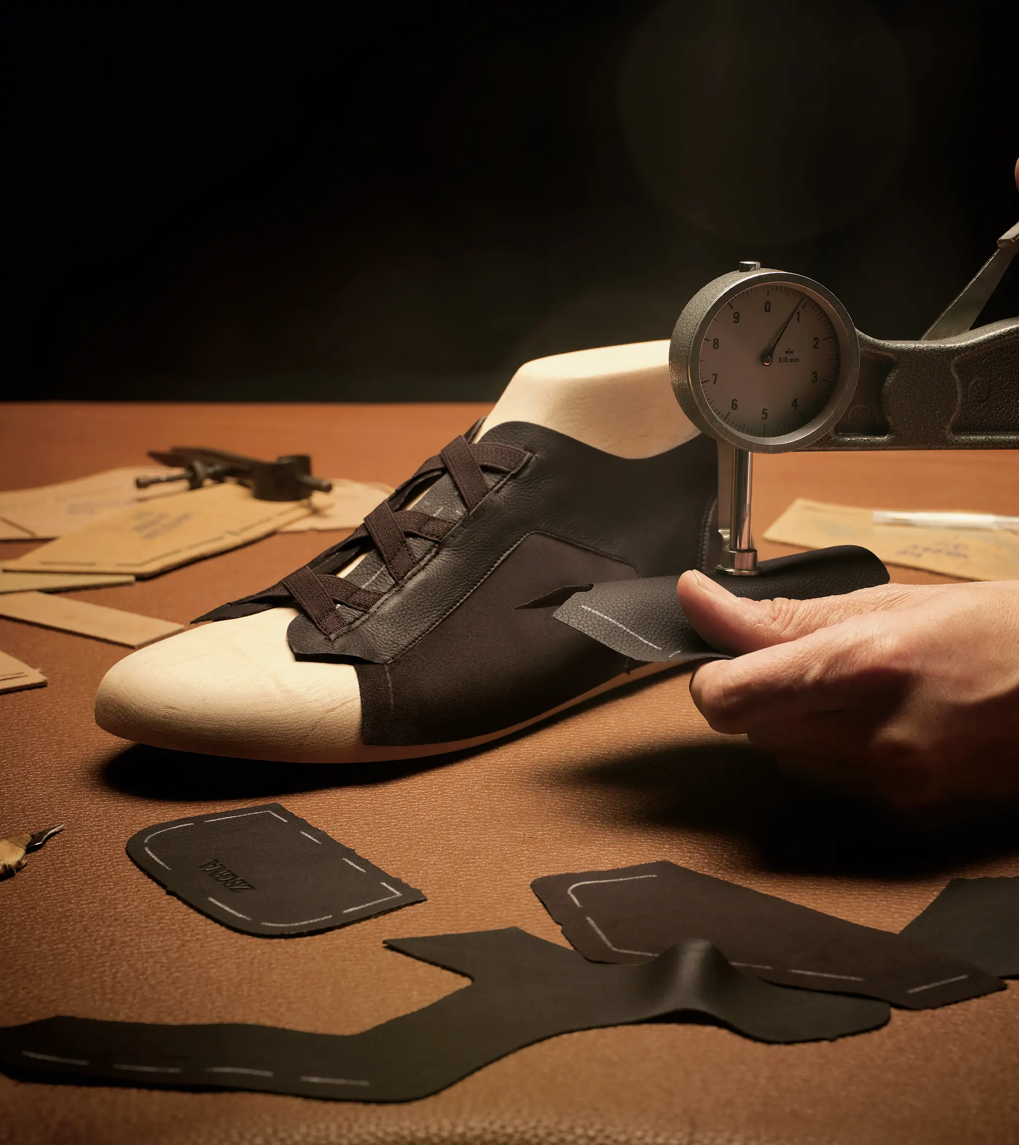 ZEGNA artisan crafting Triple Stitch™ sneakers with SECONDSKIN leather.