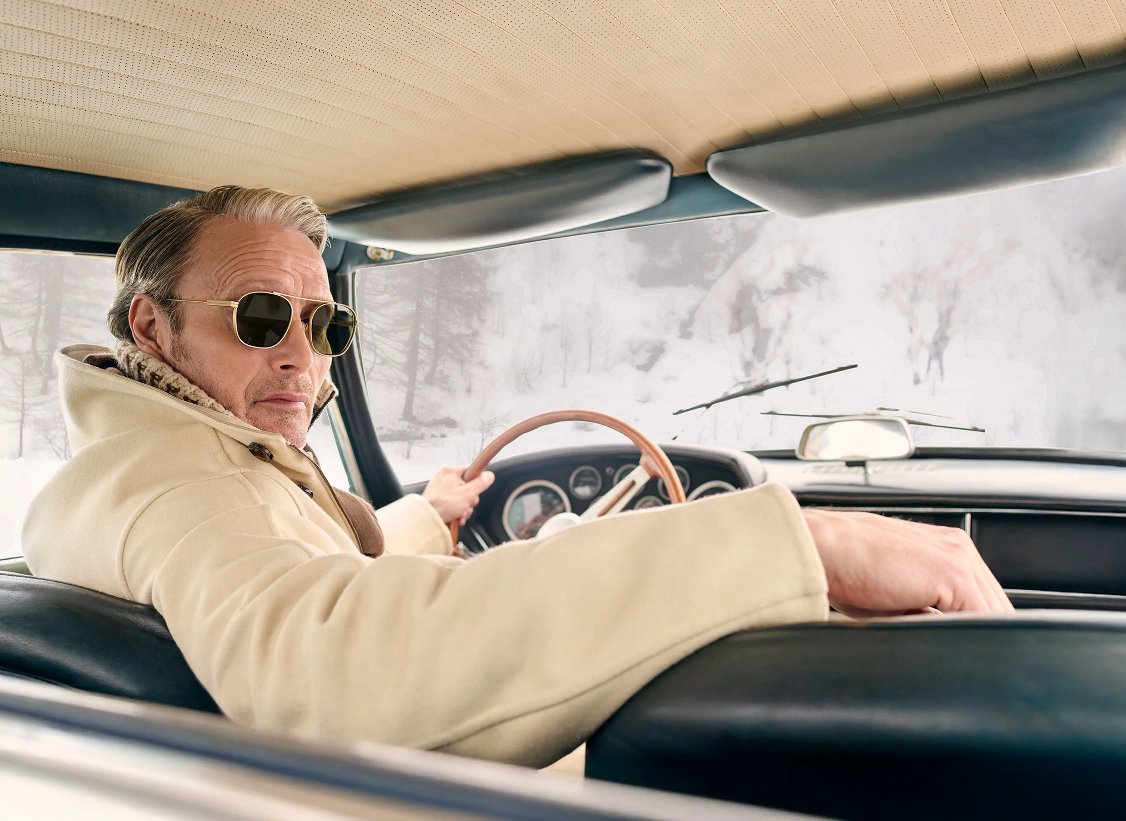 Mads Mikkelsen wearing a ZEGNA winter look featuring a ski suit.